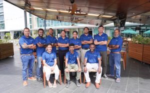 The three interns who transitioned to full-time employees (seated) alongside the SNS Tech team at the internship program graduation ceremony earlier this week.